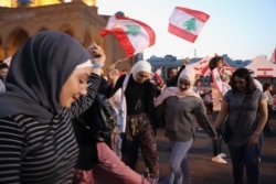 Every day for more than a month, demonstrators have been in the streets expressing their anger and celebrating what they call their "revolution" in Beirut, Lebanon, Nov. 17, 2019. (Heather Murdock/VOA)