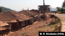 Clothes hang on a clothes line in front of a row of largely abandoned homes, in Kumbo, Cameroon, Jan. 3, 2019.