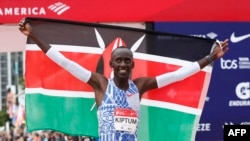 FILE - Kenya's Kelvin Kiptum celebrates winning the 2023 Bank of America Chicago Marathon in Chicago, Illinois, in a world record time of two hours and 35 seconds on October 8, 2023.