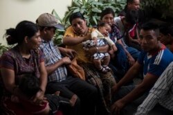 FILE - Families wait to be reunited with their children who were separated from them by U.S. immigration authorities, at the shelter Nuestras Raíces in Guatemala City, Aug. 7, 2018.