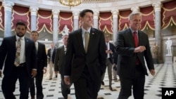 House Speaker Paul Ryan, R-Wis., center, and Majority Leader Kevin McCarthy, R-Calif., right, walk to the chamber where the House voted overwhelmingly to send a $15.25 billion disaster aid package to President Donald Trump, overcoming conservative objections to linking the emergency legislation to a temporary increase in America's borrowing authority, at the Capitol in Washington, Sept. 8, 2017. 