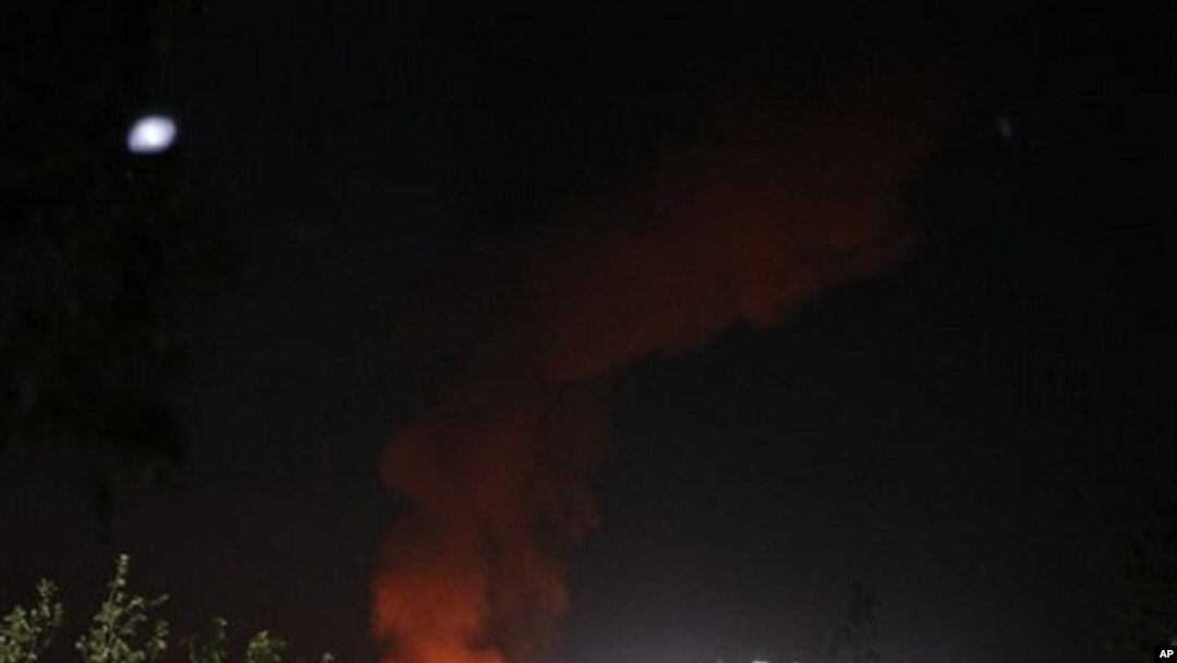 A plume of smoke and fire is seen after an airstrike in Tripoli, Libya, June 14, 2011.