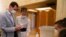 In this photo released on the official Facebook page of Syrian Presidency, Syrian President Bashar Assad and his wife Asma voting at a polling station in the parliamentary elections, in Damascus, Syria, July 19, 2020. 