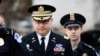 Army Lieutenant Colonel Alexander Vindman, a military officer at the National Security Council, center, arrives on Capitol Hill in Washington, to testify as part of the impeachment inquiry into President Donald Trump, Oct. 29, 2019. 