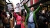 People celebrate outside the Old Bailey, the Central Criminal Court, in London, after a British judge ruled that WikiLeaks founder Julian Assange should not be extradited to the United States.