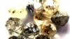 FILE - Rough diamonds are displayed at the Botswana Diamond Valuing Company in Gaborone. 