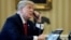 FILE - U.S. President Donald Trump speaks by phone in the Oval Office at the White House in Washington, Jan. 29, 2017.