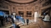 House impeachment managers walk the article of impeachment against former President Donald Trump through the Rotunda of the US Capitol in Washington, Jan. 25, 2021.