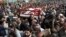 Mourners attend the funeral of Pakistani human rights activist Asma Jahangir in Lahore, Pakistan, Feb. 13, 2018.