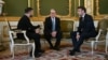 Ukraine's President Volodymyr Zelenskyy, Britain's Prime Minister Keir Starmer and France's President Emmanuel Macron hold a meeting during a summit at Lancaster House in central London, March 2, 2025. 