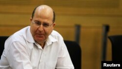 FILE -Moshe Yaalon attends a Likud-Beiteinu party meeting at the Knesset, in Jerusalem, March 14, 2013.