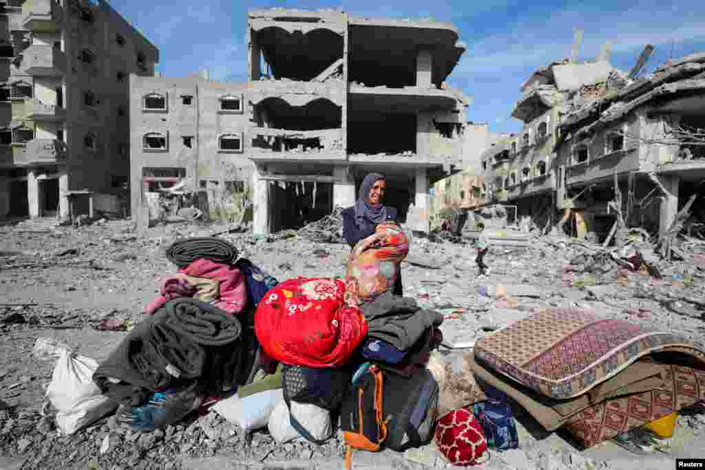 A Palestinian woman reacts as she returns to her destroyed house, following a ceasefire between Israel and Hamas, in Jabalia in the northern Gaza Strip, Jan. 19, 2025. 