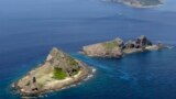 A group of disputed islands, Uotsuri island (top), Minamikojima (bottom) and Kitakojima, known as Senkaku in Japan and Diaoyu in China is seen in the East China Sea, in this photo taken by Kyodo September 2012. Japan and ally the United States sharply cri