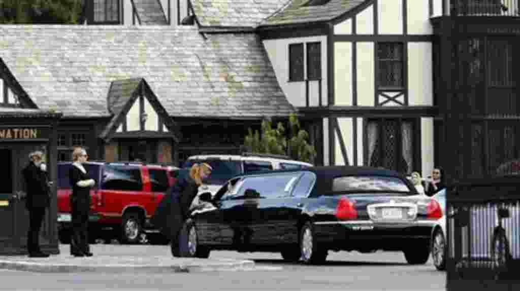 A stretch limousine arrives at Forest Lawn Cemetery for funeral services for Elizabeth Taylor in Glendale, Calif., March 24, 2011
