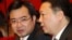 FILE - Nguyen Thanh Nghi, left, pictured with Vietnamese Vice Minister of National Resources and Environment Tran Hong Ha in 2011, has become one of the youngest provincial party chiefs in Vietnam at age 39.