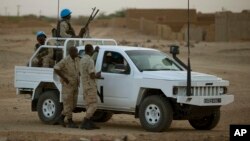 FILE - A vehicle with United Nations peacekeepers is seen in Kidal, Mali.