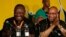 FILE: South Africa's President Jacob Zuma, right, jokes with his deputy, Cyril Ramaphosa, after Zuma's re-election in 2012. The ruling African National Party has delayed an inquiry into Zuma's spending.