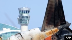 This picture shows the control tower and the Jeju Air Boeing 737-800 aircraft which crashed and burst into flames at Muan International Airport in Muan, some 288 kilometers southwest of Seoul on Jan. 2, 2025.