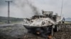 A U.N. peacekeeping armored personnel carrier burns during clashes with M23 rebels outside Goma, Democratic Republic of Congo, on Jan. 25, 2025.