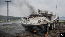 A U.N. peacekeeping armored personnel carrier burns during clashes with M23 rebels outside Goma, Democratic Republic of Congo, on Jan. 25, 2025.