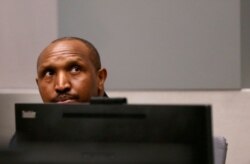 FILE - Congolese militia commander Bosco Ntaganda sits in the courtroom of the International Criminal Court during his trial at the Hague, in the Netherlands, July 8, 2019.