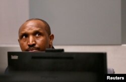 FILE - Congolese militia commander Bosco Ntaganda sits in the courtroom of the International Criminal Court during his trial at the Hague, in the Netherlands, July 8, 2019.