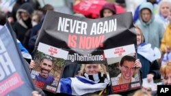 FILE - People attend a protest with families of hostages and former hostages from the October 7 cross-border attack by Hamas on Israel, near the International Crime Court at The Hague, Netherlands, February 14, 2024.