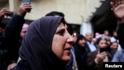 In photos: Syrians desperately search for missing relatives in notorious prison