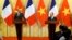 French Primer Minister Edouard Philippe (L) looks on as Vietnam's Prime Minister Nguyen Xuan Phuc speaks during their joint press conference at International Convention Center in Hanoi, Nov. 2, 2018.