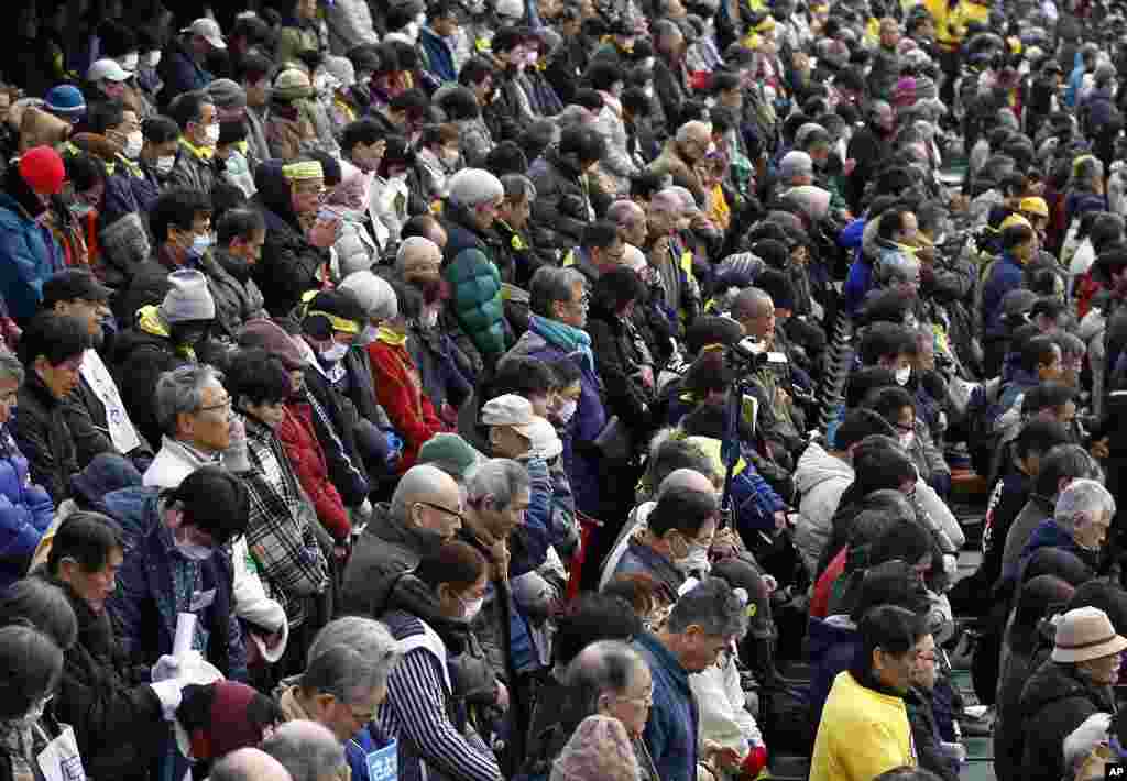 Protesters observe a moment of silence for victims of the March 11 earthquake at the same time it struck last year, during an anti-nuclear rally in Koriyama, Fukushima prefecture, March 11, 2012. (Reuters)