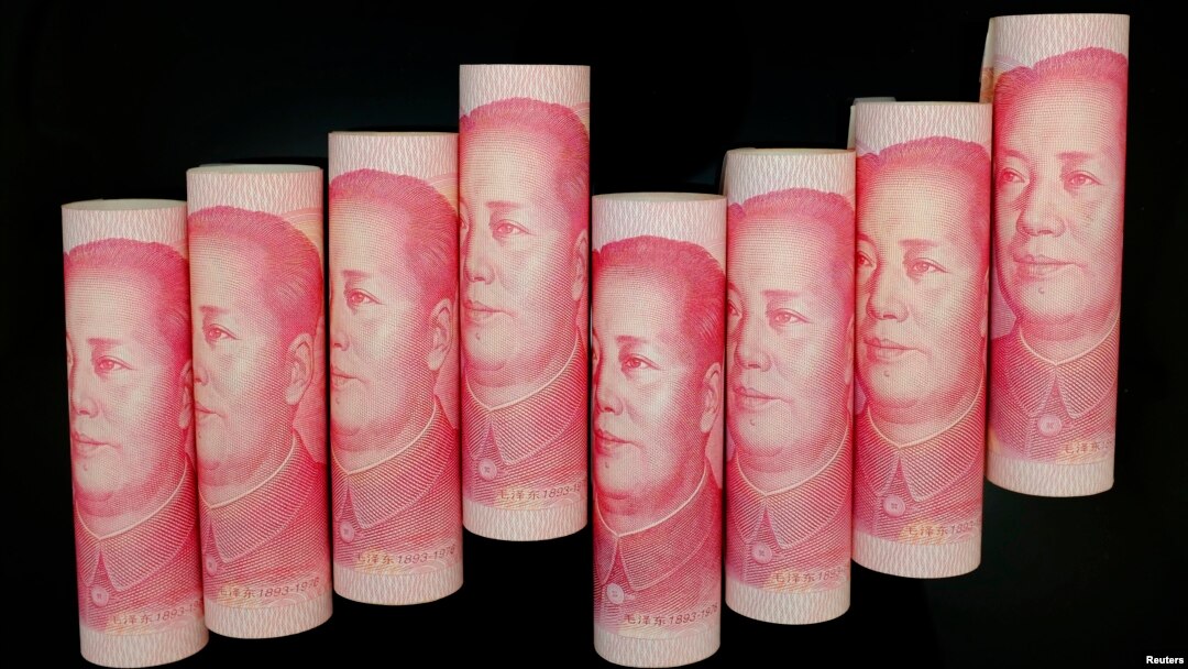 FILE - 100 Yuan notes are seen in this illustration picture in Beijing.