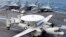 An E-2C Hawkeye lands on the deck of U.S. aircraft carrier USS George Washington during joint military drills between the U.S. and South Korea in the Yellow Sea, southwest of Seoul, June 24, 2012.