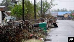 Debris sits near a street after Hurricane Laura hit nearly a month ago ahead of Hurricane Delta, in Lake Charles, Louisiana, Oct. 9, 2020. 