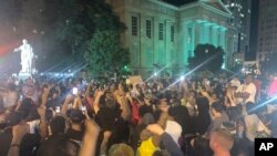 In a photo provided by Jada W., protesters gather Thursday, May 28, 2020, in downtown Louisville, Ky., against the police shooting of Breonna Taylor, a black woman fatally shot by police in her home in March.