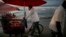 A vendor of seafood cocktails pushes his cart along the shore in Cartagena, Colombia, Tuesday. Colombia's government and the Revolutionary Armed Forces of Colombia, FARC, signed on Monday a peace agreement to end over 50 years of conflict.