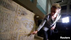 Friederike Seyfried, Director of the Egyptian Museum and Papyrus Collection in Berlin, Germany, shows damages after unknown perpetrators damaged numerous pieces of art and antiques at the museum island, Oct. 21, 2020.