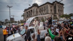 Pope Francis waves to wellwishers as he leaves after a meeting at the Cathedral of the Immaculate Conception in the capital Maputo, Mozambique, Sept. 5, 2019. 