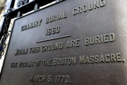 A plaque is posted at the entrance to the Granary Burial Ground in Boston, March 3, 2020.