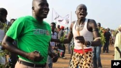 South Sudan men celebrate independence at a ceremony in Juba.