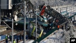 Members of rescue services work at the scene of a train accident in Ankara, Turkey, Dec. 13, 2018. 