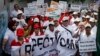 FILE - Indian people march during a 'I Respect Women' walk for gender equality organized by a local hotel and Association of Domestic Tour Operators of India in New Delhi, India.