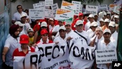 FILE - Indian people march during a 'I Respect Women' walk for gender equality organized by a local hotel and Association of Domestic Tour Operators of India in New Delhi, India.