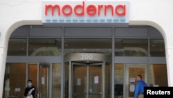 FILE PHOTO: A sign marks the headquarters of Moderna Therapeutics, which is developing a vaccine against the coronavirus disease (COVID-19), in Cambridge, Mass., May 18, 2020. 