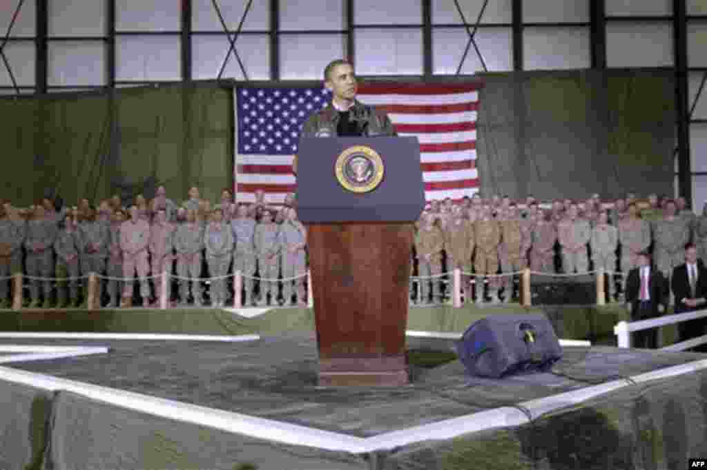 President Barack Obama speaks to the troops at a rally during an unannounced visit at Bagram Air Field in Afghanistan, Friday, Dec. 3, 2010. (AP Photo/Pablo Martinez Monsivais)