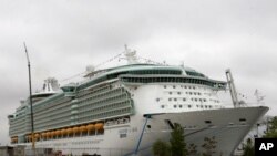 FILE - The Freedom of the Seas cruise ship is seen docked in Bayonne, New Jersey, May 11, 2006. A young girl slipped from her grandfather’s hands, falling about 46 meters from the vessel to her death in July 2019. 