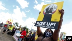 Protesters rally outside a McDonald's in Detroit, July 20, 2020, as the national workers strike saw people walk off the job in U.S. cities to protest systemic racism and economic inequality.