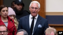 FILE - Roger Stone, a confidant of President Donald Trump, enters the House Judiciary Committee hearing room to hear testimony by Google CEO Sundar Pichai, on Capitol Hill in Washington, Dec. 11, 2018. 