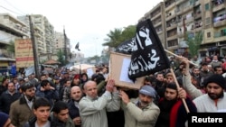 Lebanese Sunnis march through the northern city of Tripoli carrying coffins of Lebanese militants killed in Syria last December. Sunni militants from Lebanon have been fighting with Syrian rebels to oust Syria's Assad government. 