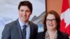 FILE - Newly appointed president of the Treasury Board Jane Philpott poses for a photo with Prime Minister Justin Trudeau during Trudeau's cabinet shuffle, in Ottawa, Ontario, Canada, Jan. 14, 2019.