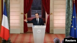 French President Francois Hollande addresses a news conference at the Elysee Palace in Paris, Jan. 14, 2014. 